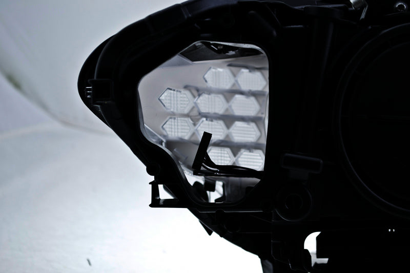 HELLA Headlight Assembly - 010131651